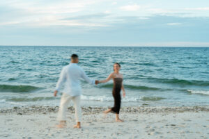 engaged couple enjoying the beach at Sandy Neck beach 